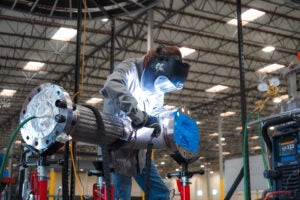 Antares lead technician Nate Jandra welds a power conversion system component in Torrance, California.
